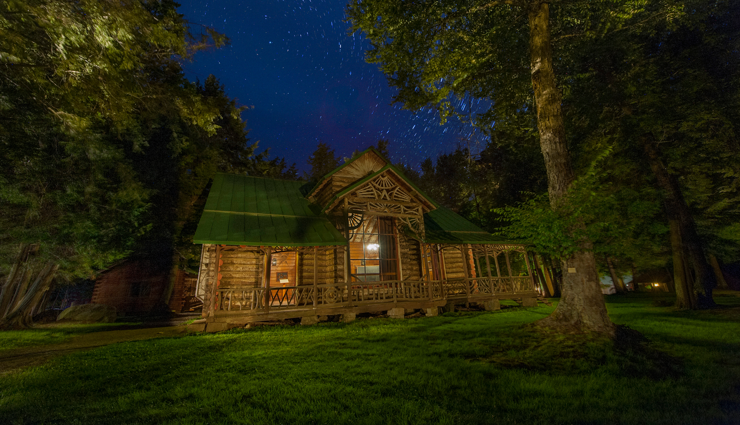 Seen here at night, Great Camp Pine Knot became William West Durant&rsquo;s most enduring legacy