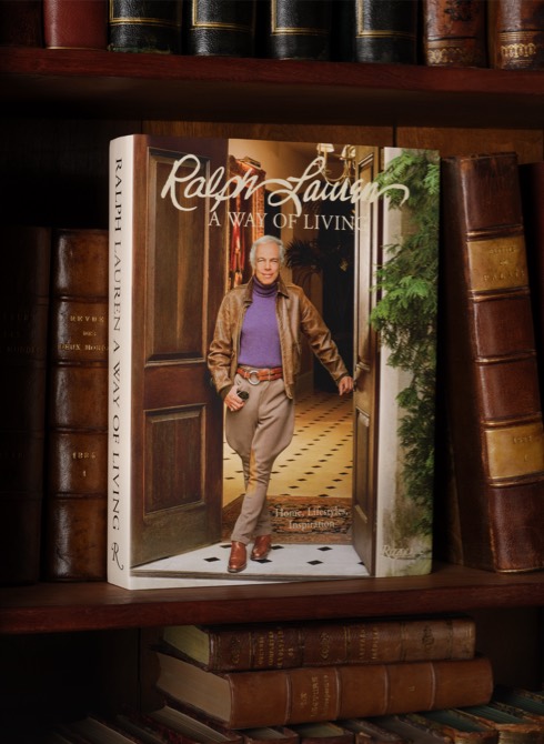 Ralph on cover of A Way of Living book on a bookshelf.
