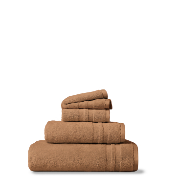 Stack of three beige towels.