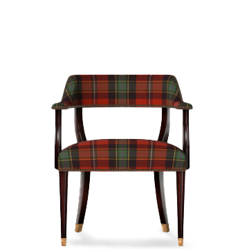 Chair with green-and-red plaid cushions.