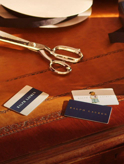 Ralph Lauren gift cards on wood desk.
